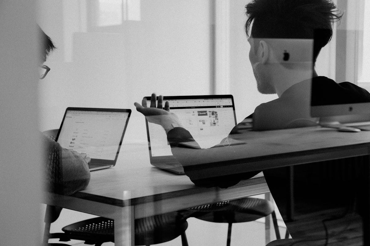 Agency workspace with laptop showing ad performance
